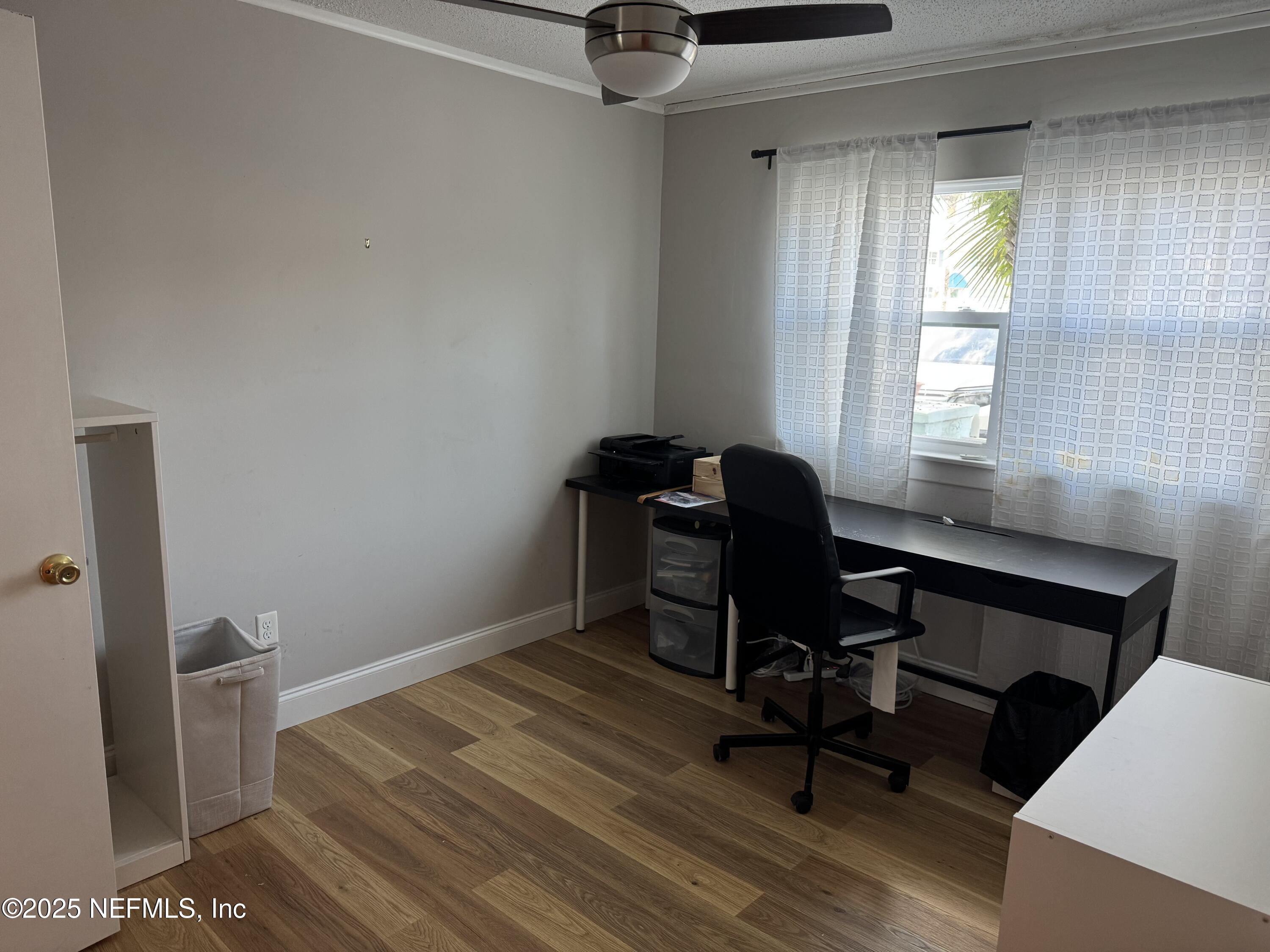 2233 Seminole Road, Unit 33 Atlantic Beach, FL 32233 - Photo 13 of 14 a view of a workspace with furniture and a window