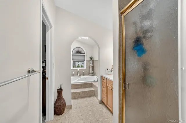 a view of a bathroom from a hallway