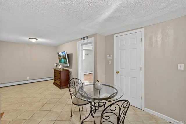 a view of a livingroom with furniture and a window
