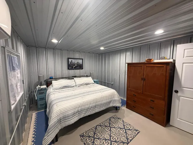 a bathroom with a sink a toilet a shower and a mirror