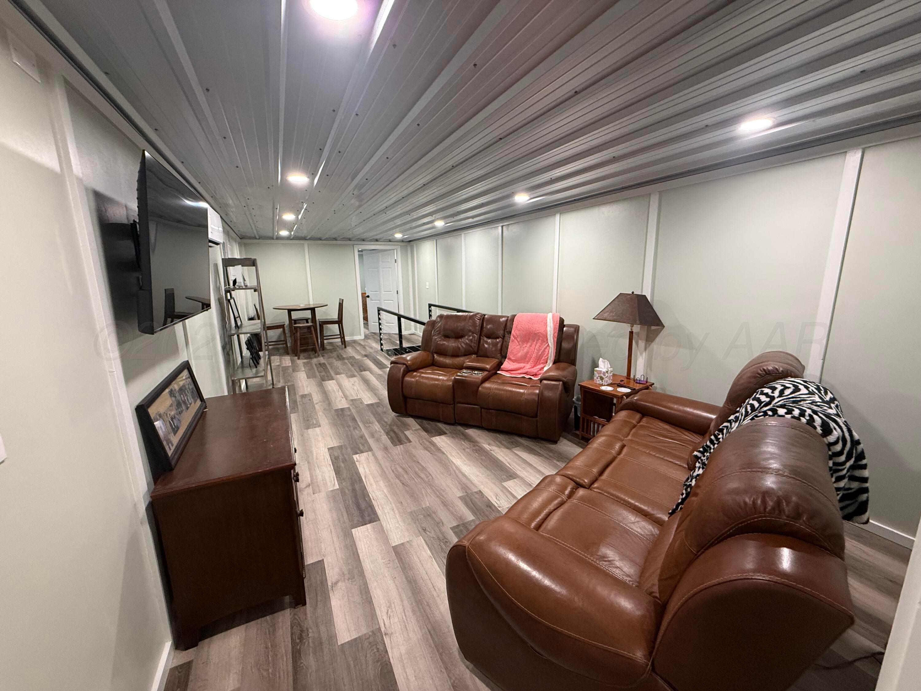 222 Bass Avenue Howardwick, TX 79226 - Photo 33 of 47 a living room with furniture and a flat screen tv