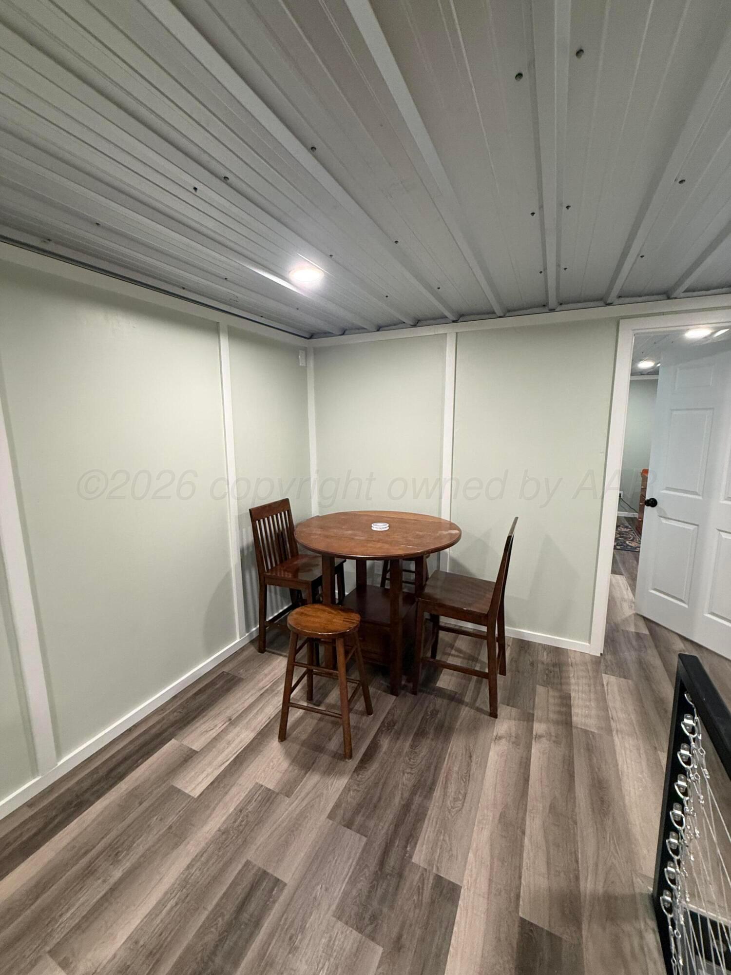222 Bass Avenue Howardwick, TX 79226 - Photo 34 of 47 a view of a dining room with furniture and wooden floor