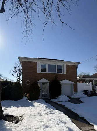 a front view of a house with parking space