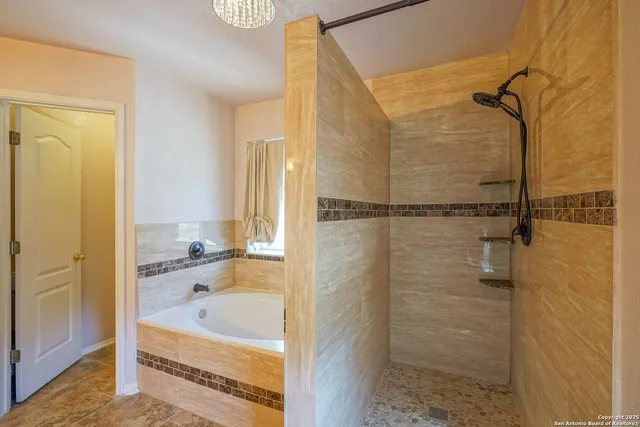 a bathroom with a bathtub and a shower