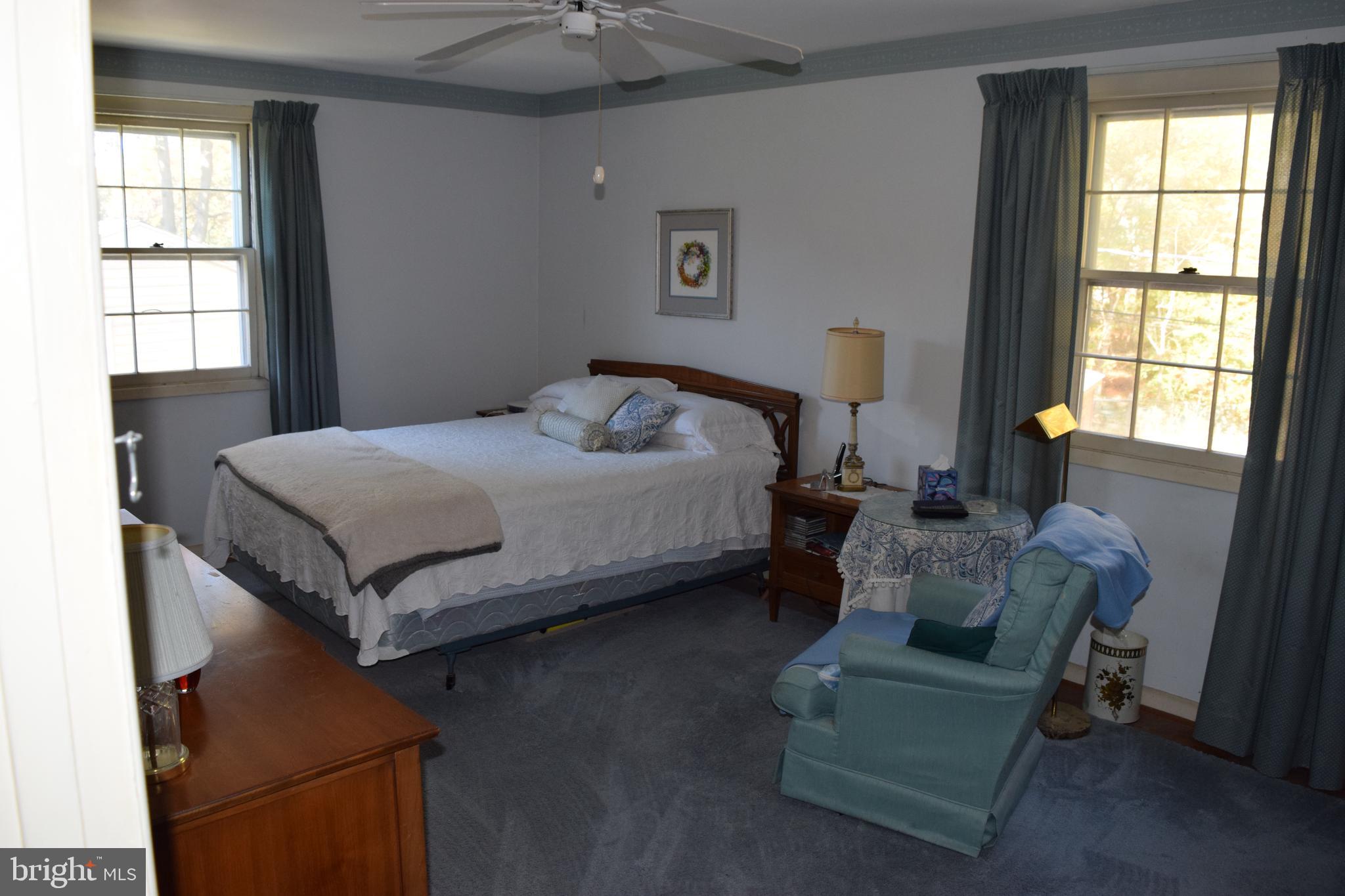 311 Radstock Road Catonsville, MD 21228 - Photo 11 of 21 a bedroom with a bed and a couch