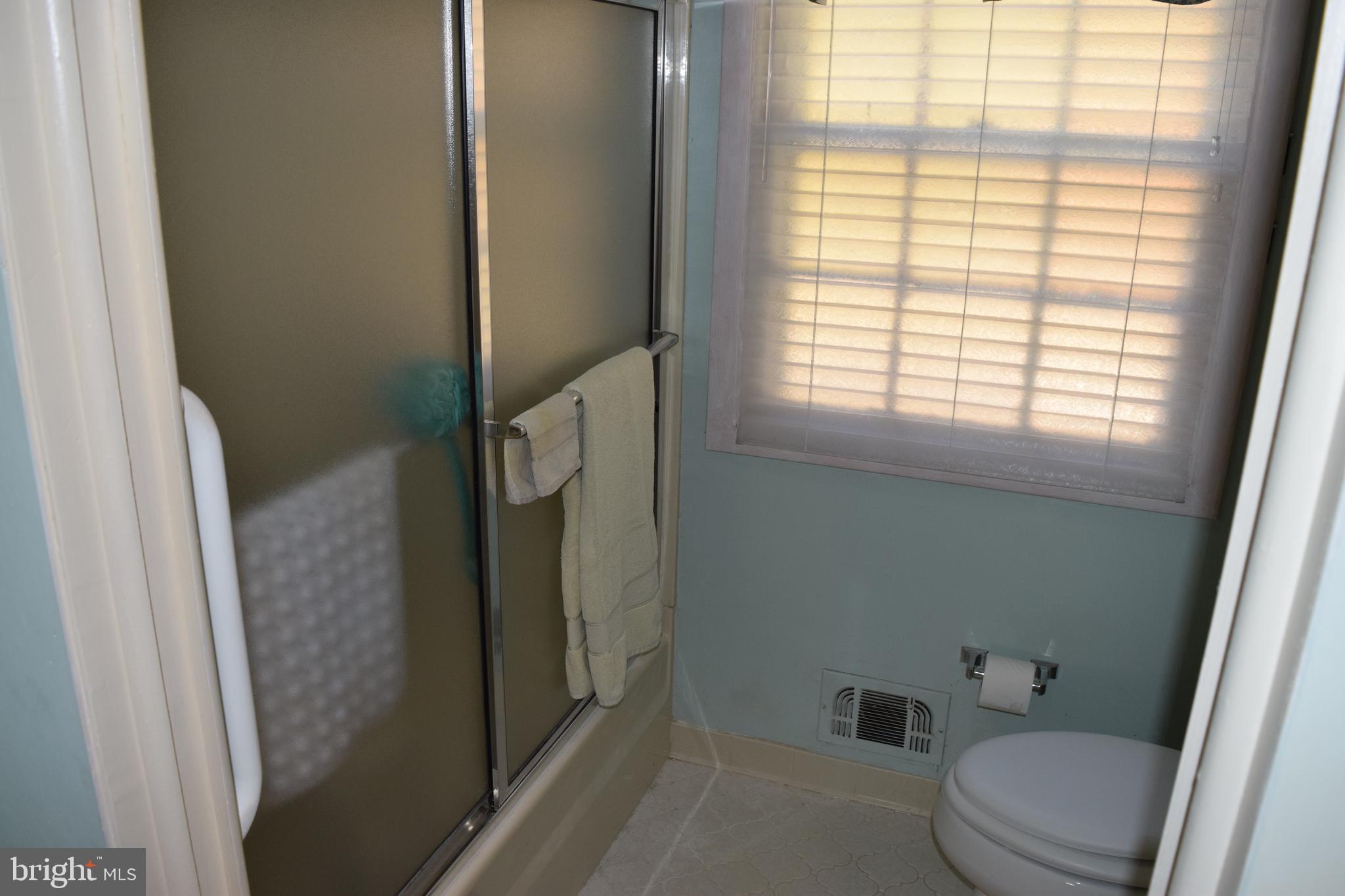 311 Radstock Road Catonsville, MD 21228 - Photo 15 of 21 a bathroom with a toilet and a shower