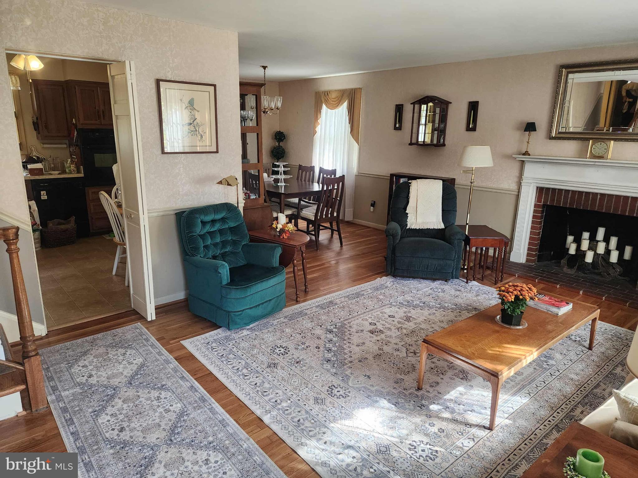 311 Radstock Road Catonsville, MD 21228 - Photo 3 of 21 a living room with furniture and a fireplace