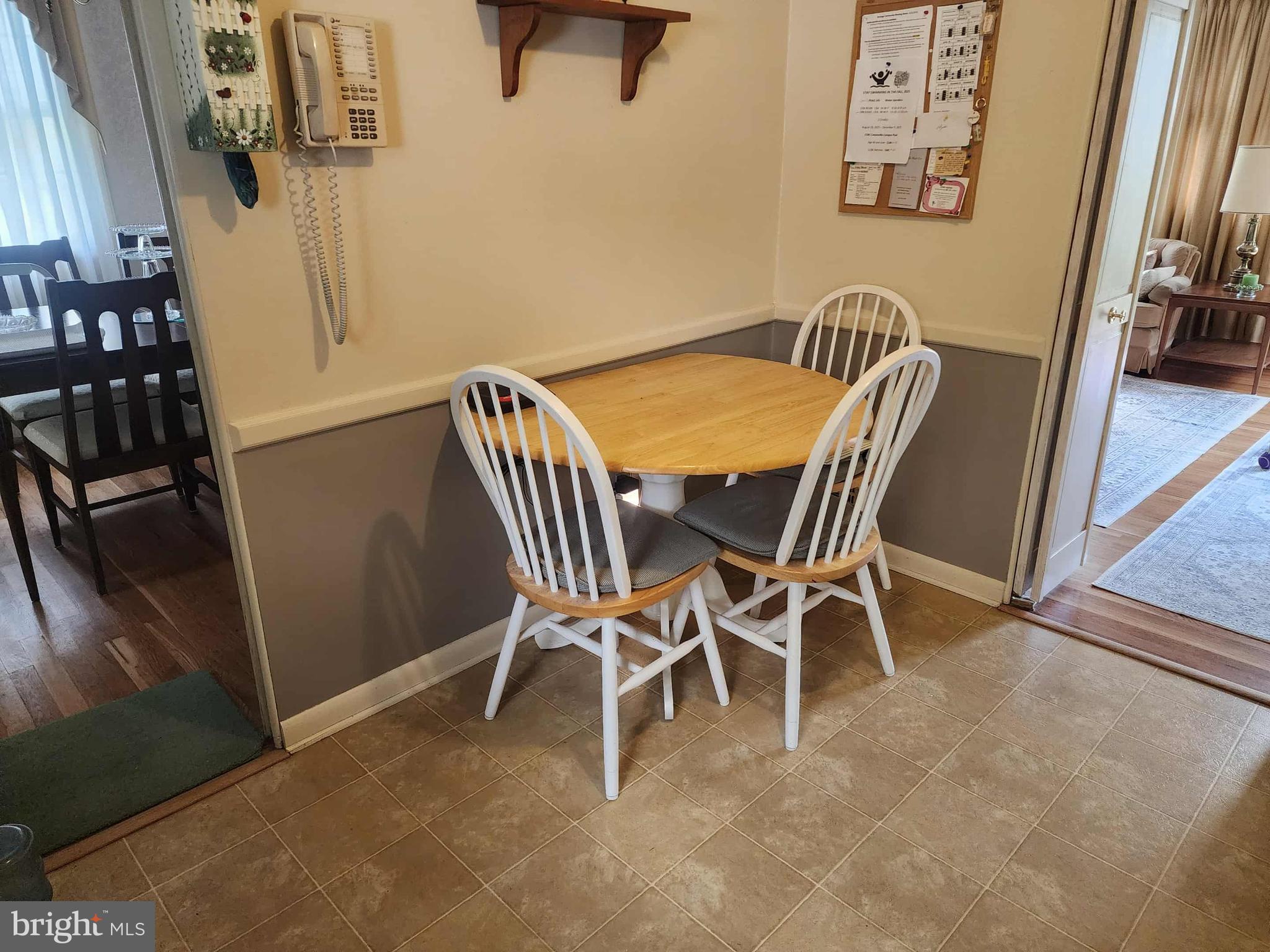 311 Radstock Road Catonsville, MD 21228 - Photo 7 of 21 a view of a dining room with furniture and a chandelier