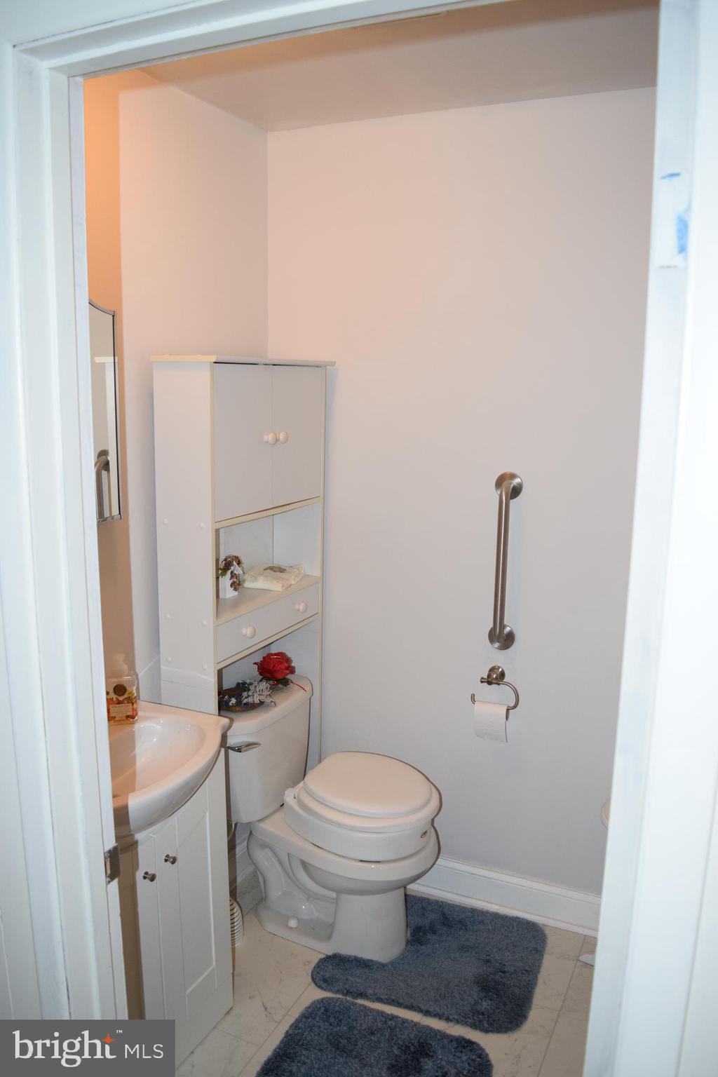 311 Radstock Road Catonsville, MD 21228 - Photo 10 of 21 a bathroom with a toilet a sink and shower
