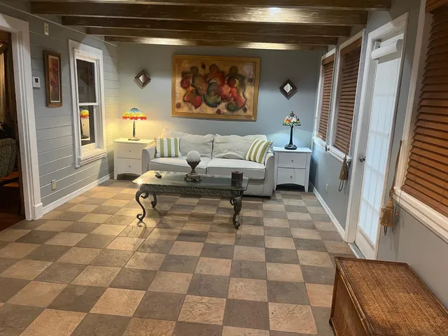 a living room with furniture and a rug