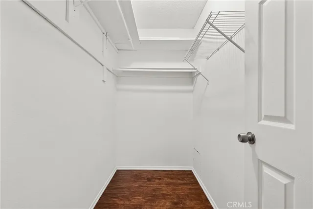 a bathroom with a sink a mirror a toilet and shower