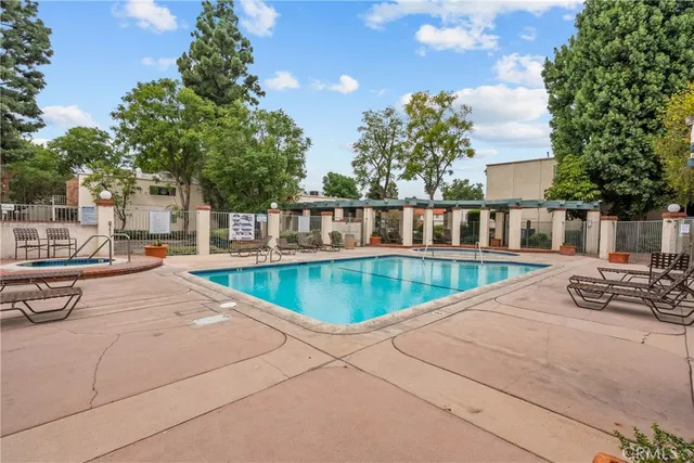 a view of a backyard with a large trees