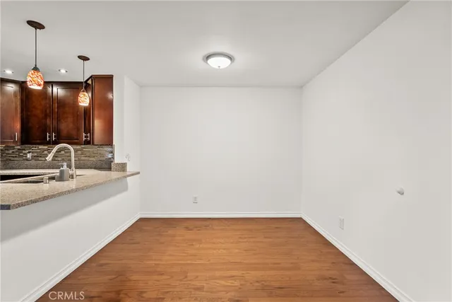 a view of a kitchen with microwave and cabinets