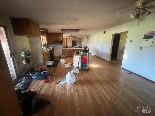 a view of a living room with wooden floor