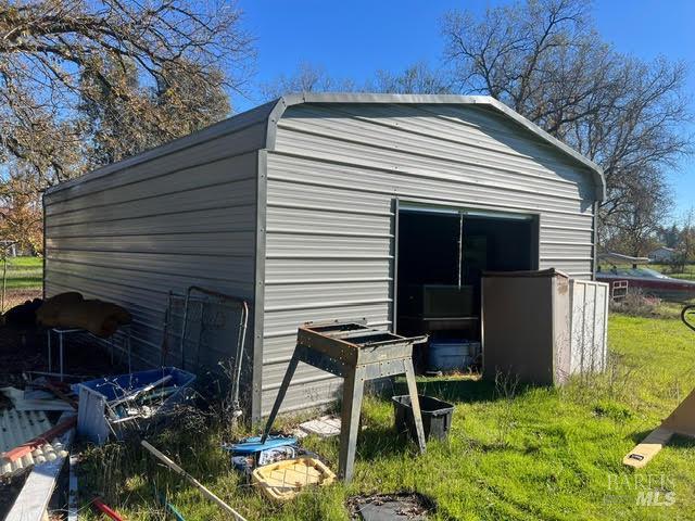 10680 Swede Creek Road Palo Cedro, CA 96073 - Photo 9 of 15 a view of backyard with a chair and potted plants