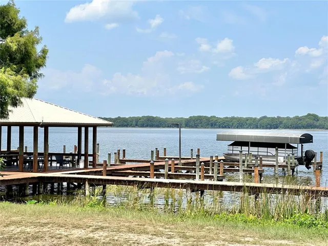 a view of swimming pool with outdoor seating