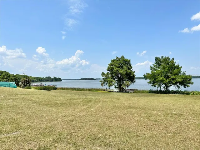 a view of a lake from a yard