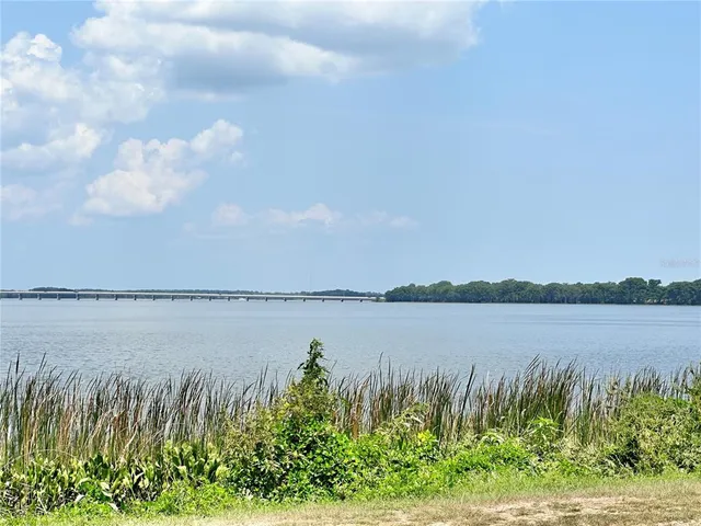 a view of a swimming pool with an ocean view
