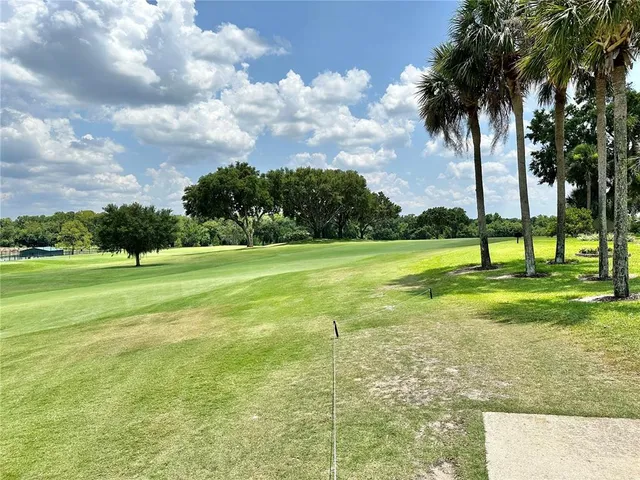a view of a lake with a big yard