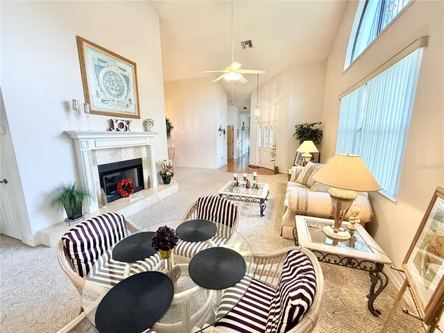 a bedroom with furniture and a fireplace