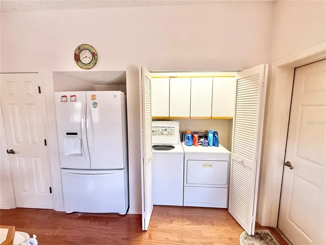a view of storage and utility room with washer and dryer