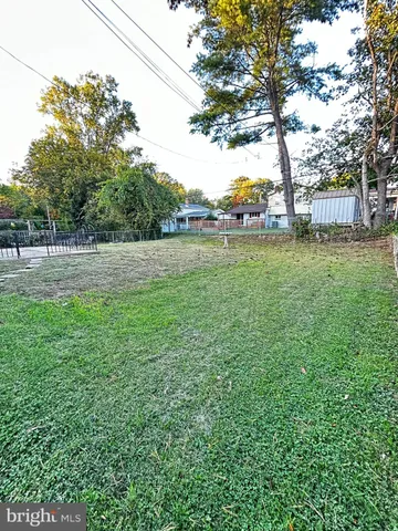 a view of outdoor space with deck and trees