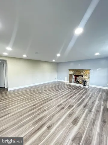 a bedroom with a bed and a mirror