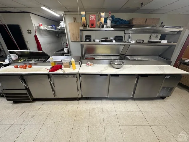 a bedroom with furniture and a wooden floor