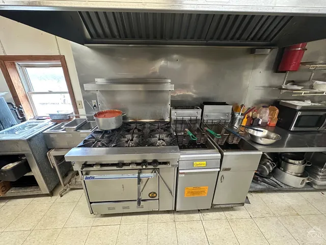 a bedroom with two beds and a couch