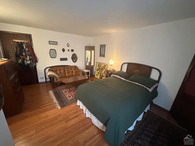 a kitchen with a stove and white cabinets