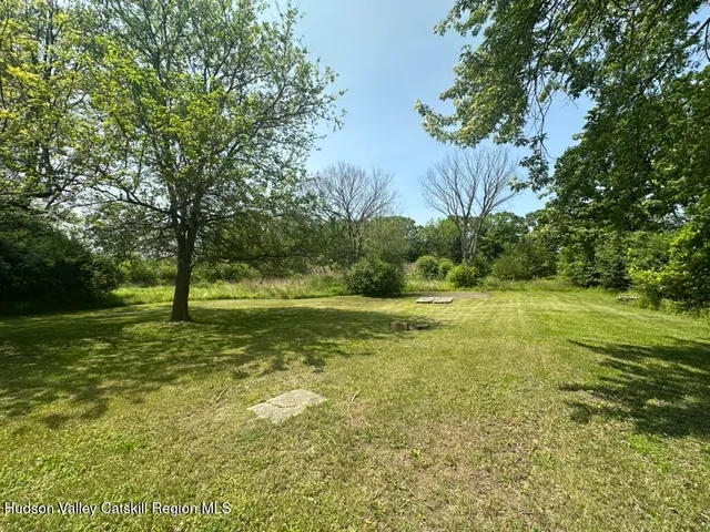 a view of outdoor space with trees all around
