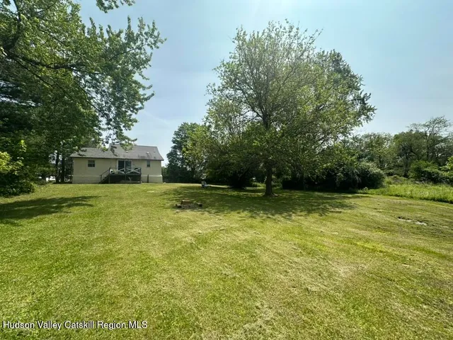 a view of a fountain in front of a house