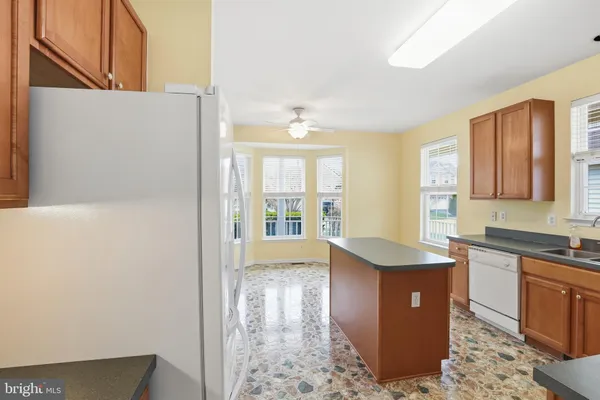 a kitchen with stainless steel appliances a sink stove and cabinets