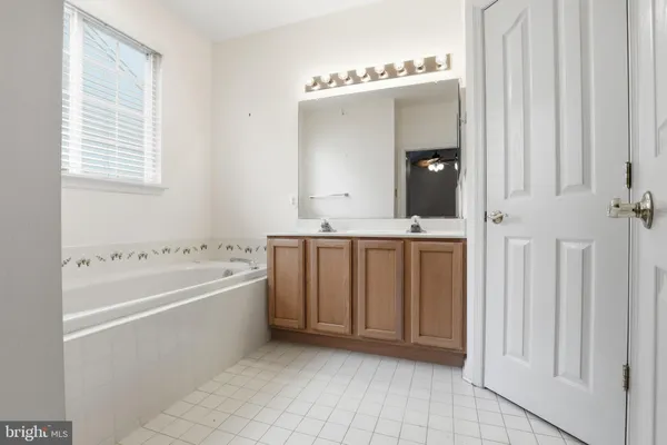 a bathroom with a bathtub and a sink