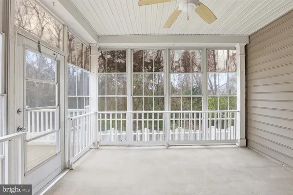 a view of backyard with deck and wooden floor