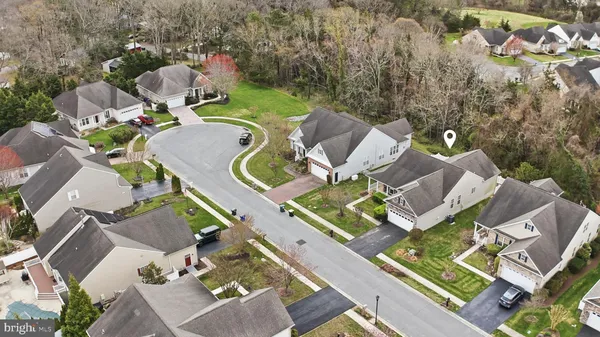 an aerial view of a house with outdoor space