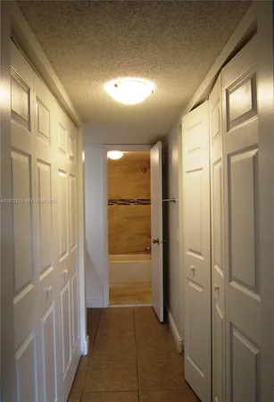 a bathroom with a shower and a glass door
