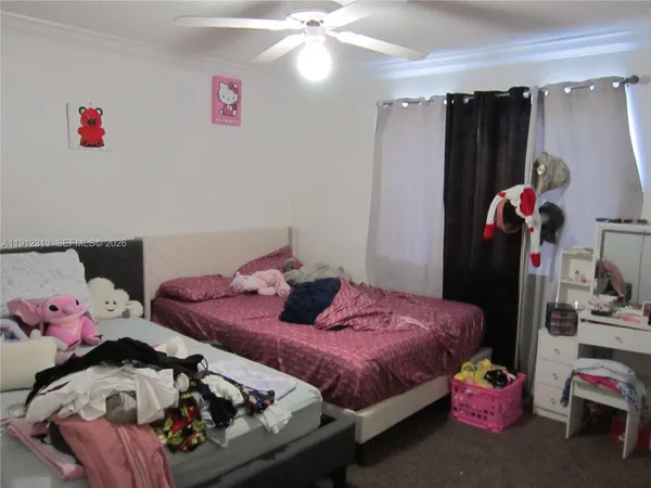 a bedroom with a bed and cabinets