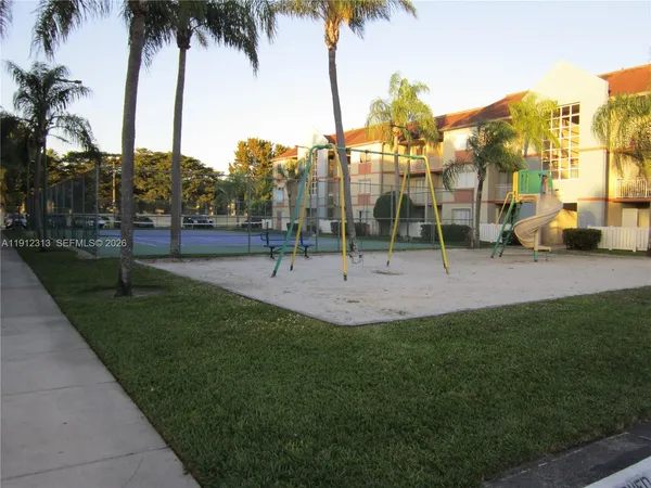a view of outdoor space with garden and trees