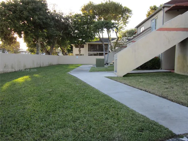 a view of a backyard with a house