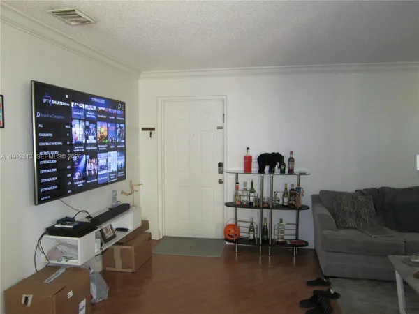 a room with furniture and a flat screen tv