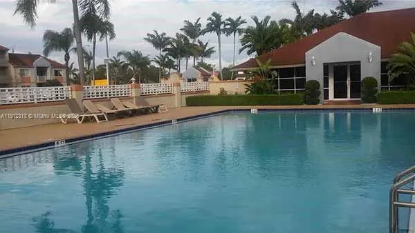 a front view of a house with a swimming pool