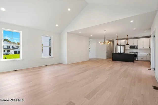 a view of a kitchen with a sink and a stove top oven