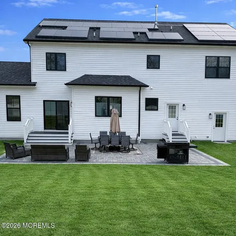 a front view of a house with patio