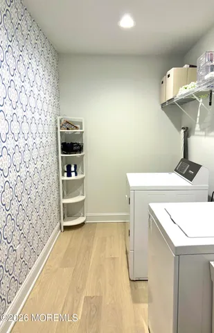 a kitchen with a sink a stove and a microwave