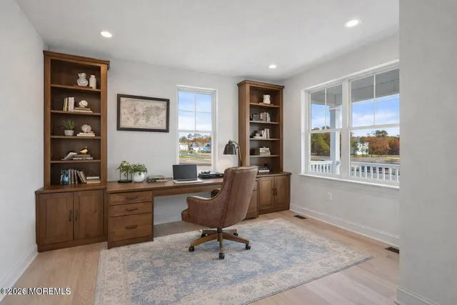 a view of a workspace with furniture
