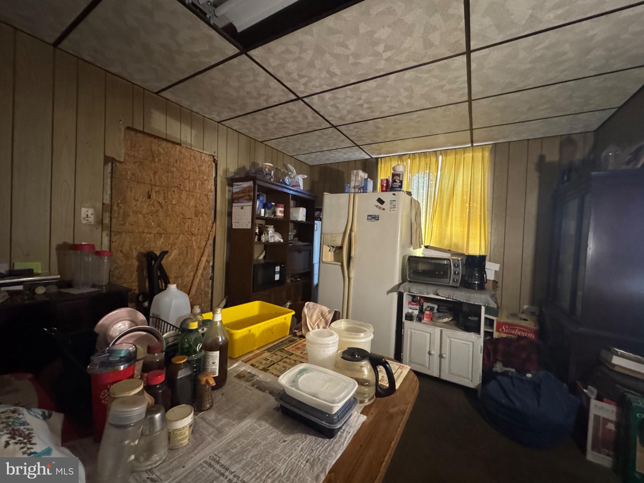 1324 Fletcher Avenue Prospect Park, PA 19076 - Photo 11 of 17 a living room with furniture a rug and a flat screen tv