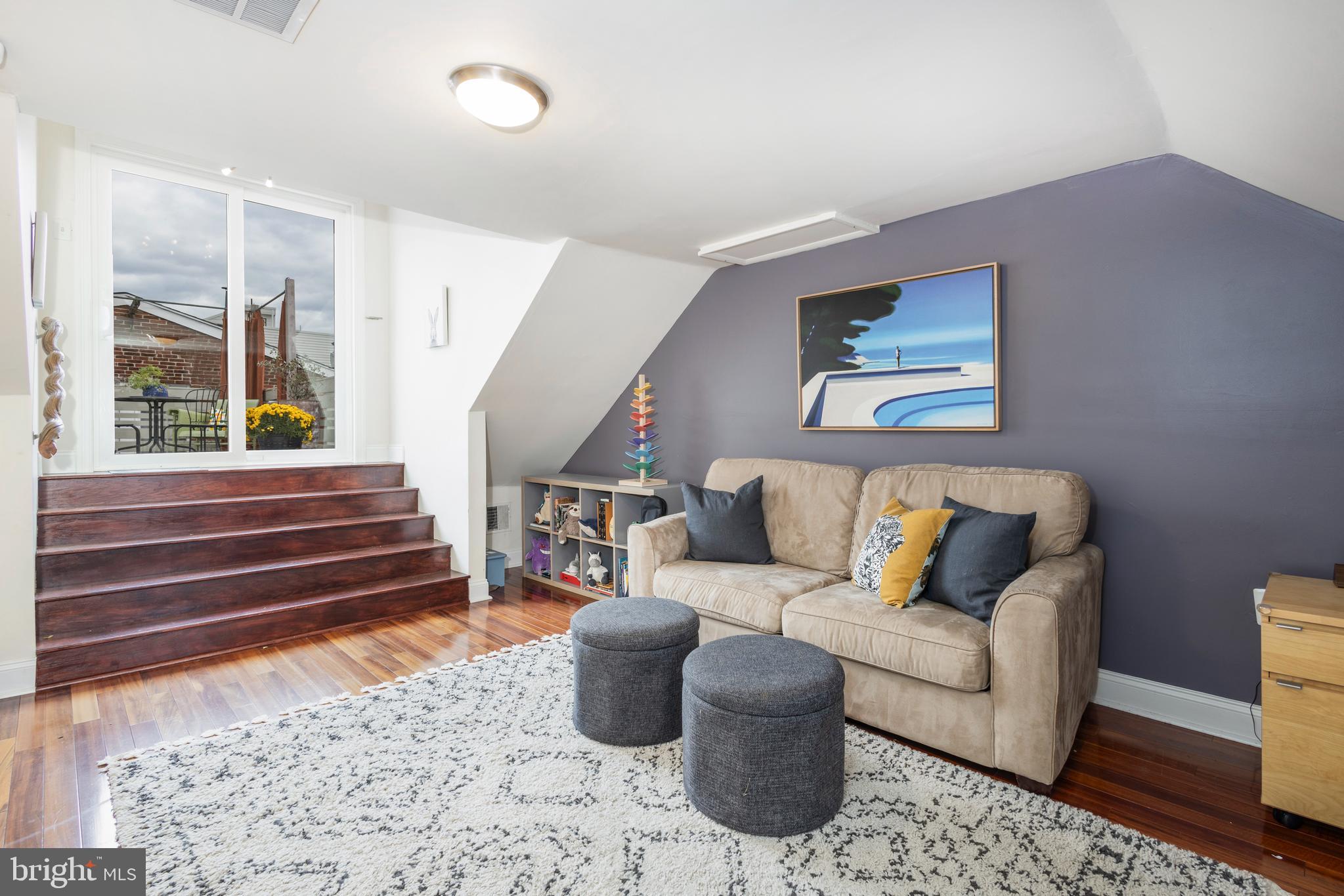 929 South 6th Street Philadelphia, PA 19147 - Photo 22 of 28 a living room with furniture and wooden floor