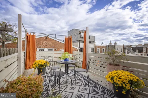 a view of a brick house with many windows