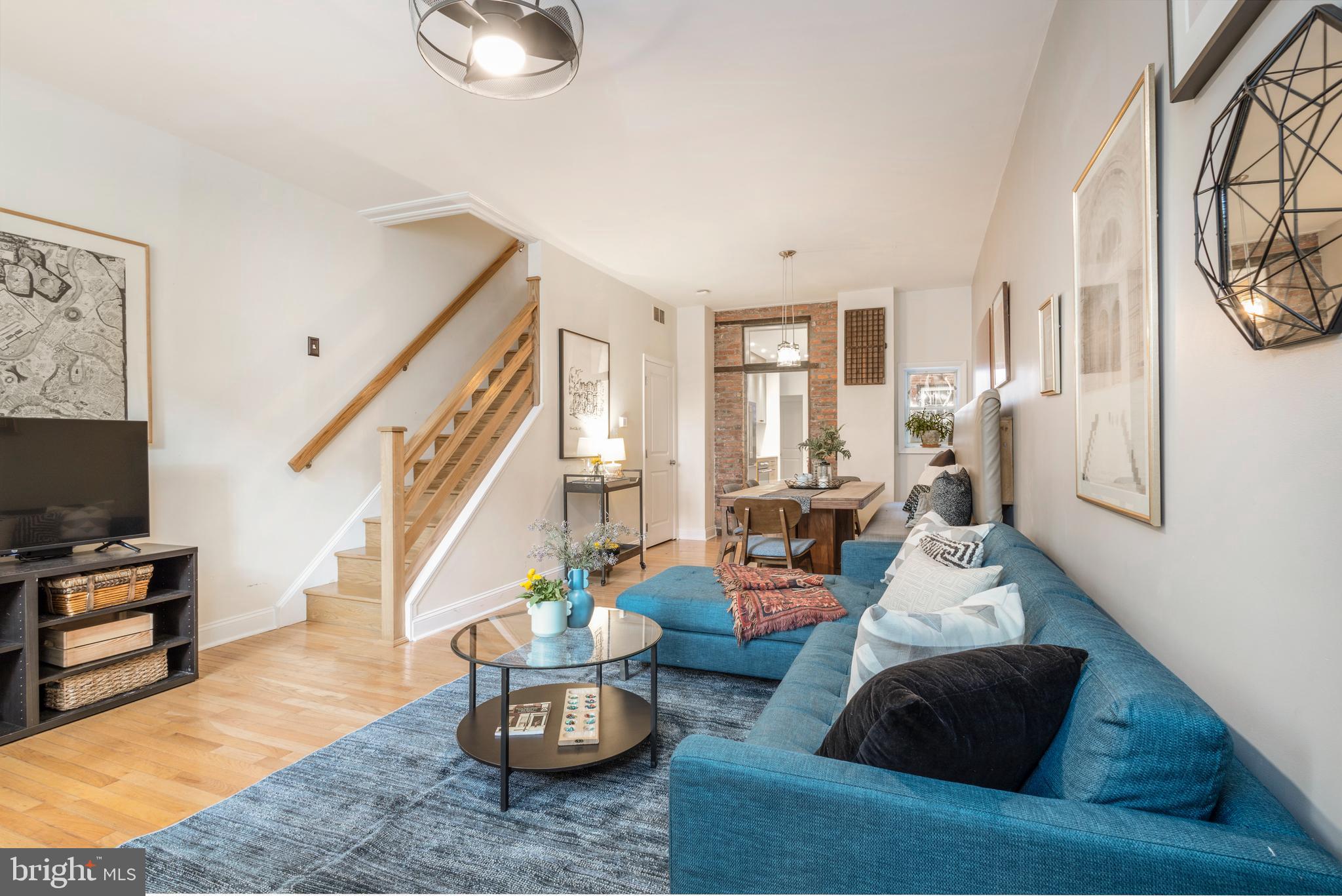 929 South 6th Street Philadelphia, PA 19147 - Photo 4 of 28 a living room with furniture and a flat screen tv